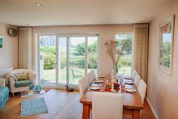 The dining-room has sliding doors to the patio, open them up on a summers day and let the fresh air in