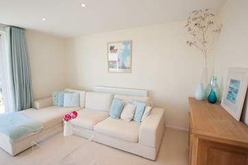 On the first floor is a bright and delightful sitting-room with balcony, boasting stunning views, an enjoyable space to watch TV or to relax with your feet up