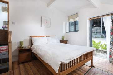 There are two steps down into this bedroom from the hallway.