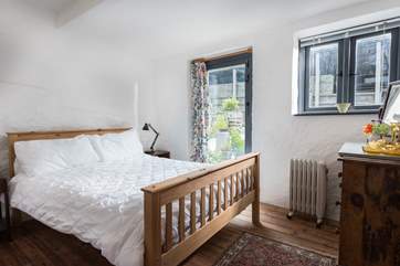 This bedroom has a double bed and door out to the terrace.