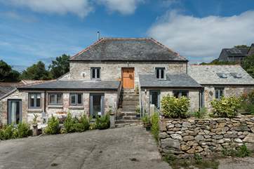 A view of this handsome home from the courtyard behind, this is a farm without animals apart from the Owners' cat who may come to say hello.