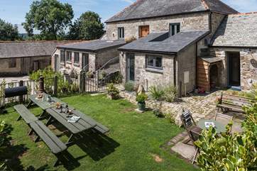 There is access to the first garden from both the kitchen and the back door by the utility-room.