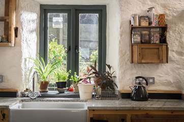 The kitchen overlooks the garden.
