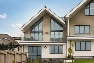 The Dream is the upstairs apartment on the end with a glass balcony.