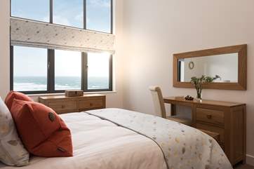 The main bedroom shares the views over the sea at Praa Sands and across the dunes to the beach below.