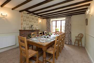 This is the dining-room. The fireplace is ornamental, making a lovely feature in the room.