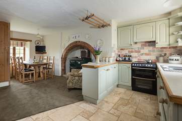 This kitchen has a warm and traditional feel with the Rayburn adding extra warmth as well as being another cooking facility. Imagine wonderful casseroles in the winter!