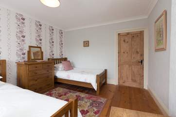 The single bed in this room provides excellent flexibility. The room is very spacious and there is plenty of room for both beds.