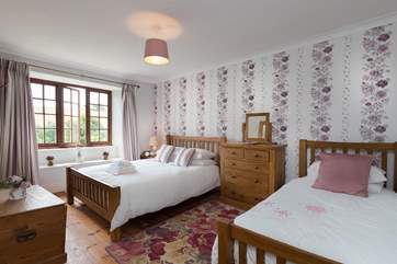 This is bedroom 1. A great family room with views over the garden and across the valley.