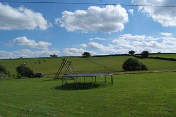 The cottage looks out at this view! A wonderful field with picnic tables and a barbecue for you to make the most of