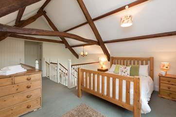 The stairs lead up into the spacious bedroom area; there are two further, separate, bedrooms. Their doors are to the far side of the stairs.