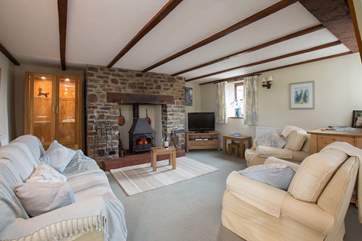 The cottage has a friendly open play layout downstairs. The wood-burning stove makes this a great place all year round.