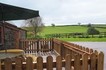 Oak Cottage has a fully fenced patio area with views across the fields.