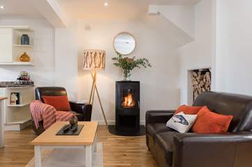 A warming wood-burner for snug evenings curled up with a book.