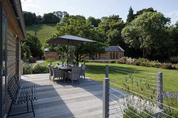 Sitting on the decked area, the shared games-room is only a hop skip and a jump away.