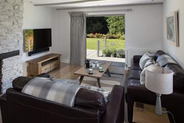 Fling open the patio doors and enjoy the beautiful sights and sounds of the grounds from the super comfy living-room.