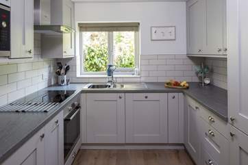 Compact yet fully equipped kitchen with all the mod-cons, making cooking in Little Coombe Cottage a pleasure.