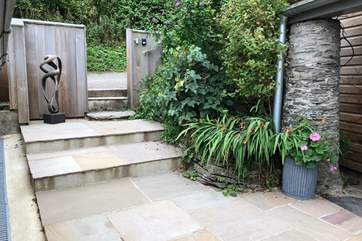 The main entrance has a few shallow steps down to the property. Please take care.
