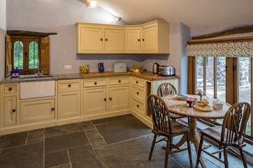 Light pours into the kitchen. Whipping up a feast in this lovely kitchen will be a pleasure.