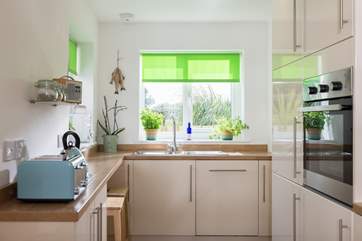The kitchen has windows to both front and rear making the room really light.