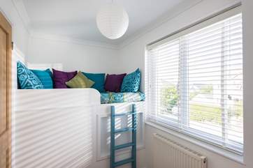 The raised sitting area in the snug sitting-room (take care with little children using the ladder).