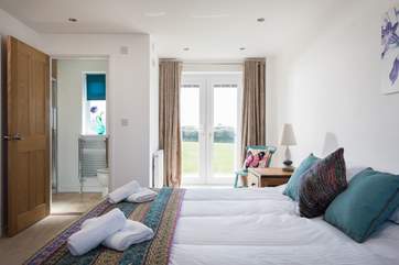 Bedroom 1 has a Juliet balcony overlooking the playing field.