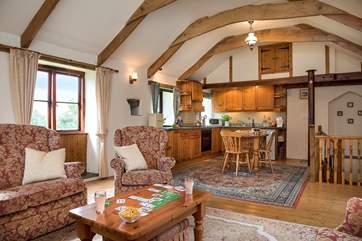 The open plan living area is on the first floor giving a bird's eye view of the countryside setting.