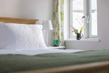 The bedroom looks out to the courtyard.