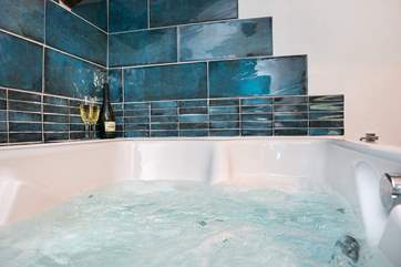 The bathroom has a fabulous double spa bath so you can indulge in bubbles of both kinds!