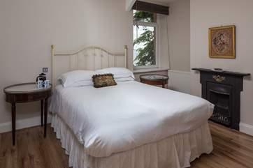Bedroom 1 enjoys lovely sea views.