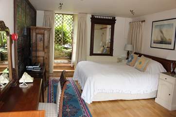 Master bedroom on the ground floor which leads out into the enclosed patio-area.
