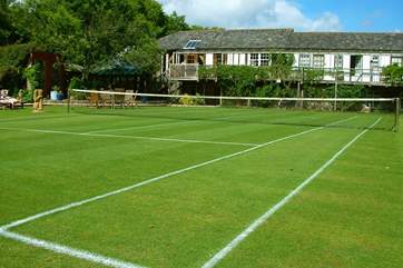 Looking across the tennis courts at The Barn.