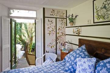 The gorgeous king-size bedroom which leads out onto the lower deck-area.