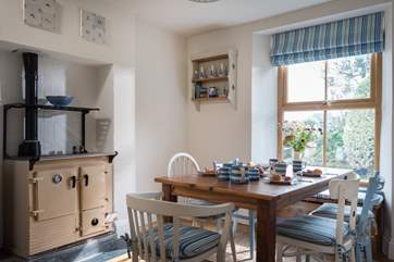 Breakfast is ready! The dining-room has an ornamental Rayburn.