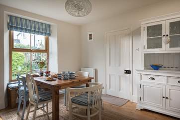 The dining-room is to the front of the house overlooking the garden.