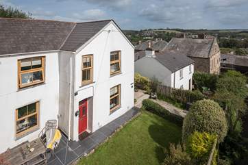A bird's eye view of the cottage showing its elevated position.
