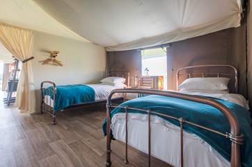 The twin bedroom leads through to the living area.