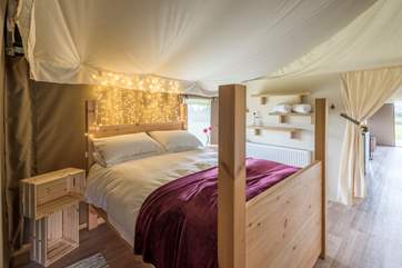 The pretty double bedroom, with king-size bed, is situated towards the back of the tent.