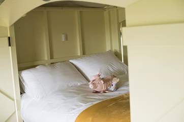 The king-size cabin bed is super cute and cosy. This fun enclosed cabin is in the main living space and there are two further separate bedrooms.