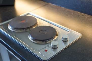 Complete with an electric hob.