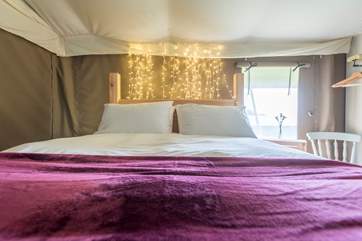 The pretty king-size bedroom is set towards the back of the tent.