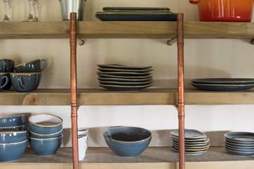The kitchen is well-equipped with all the essentials.