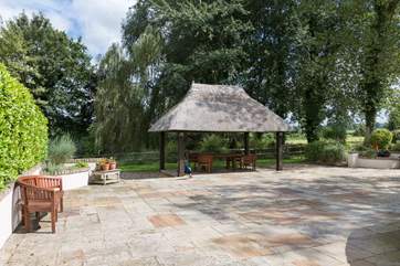 At the back of the farmhouse there is a large open terrace.