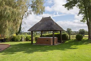 The amazing hot tub with countryside views beyond it.