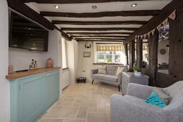 This snug is right next to the kitchen so is an ideal place for children whilst you cook up a treat.