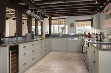 There is a stunning bespoke kitchen with a brand new range cooker.
