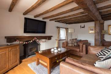This is the second living-room - a perfect chill-out room for playing Xbox games. The wood-burning stove is ornamental only for safety reasons if children are using this room.