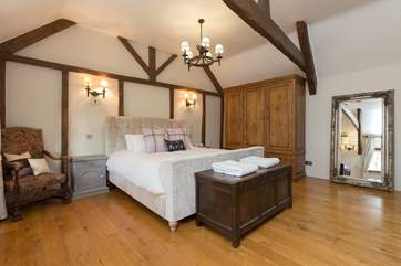 The master bedroom with its super-king sized bed is a real statement.