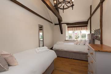 There are views over the gardens from this bedroom.