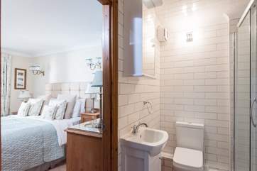 The bright, white, contemporary shower-room.